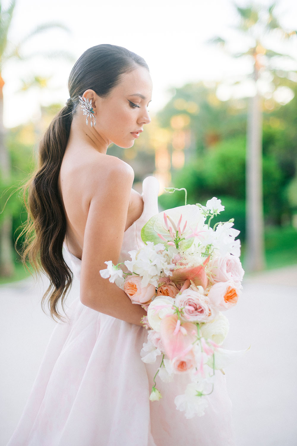 bride looks her wedding bouquet